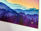 Artistic depiction of mountains and trees with a colorful sky, featuring the artist initials in gold  in the corner.